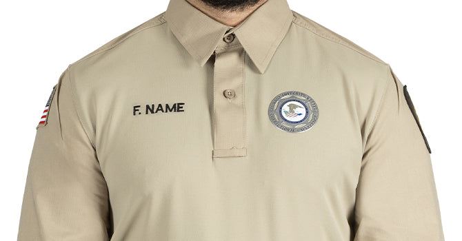 The no curl collar with integrated collar stay features a hidden button down for that professional look while on duty.