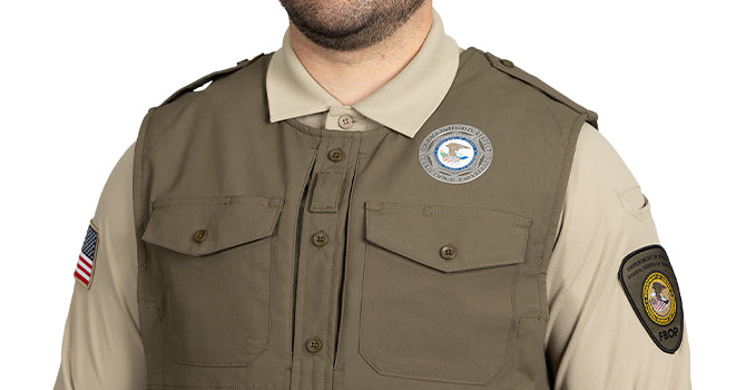 The front placket offers functionality while maintaining a professional uniform appearance. It includes durable melamine buttons, a mic loop, document pockets, and hook/loop front pockets for easy access to essential gear.