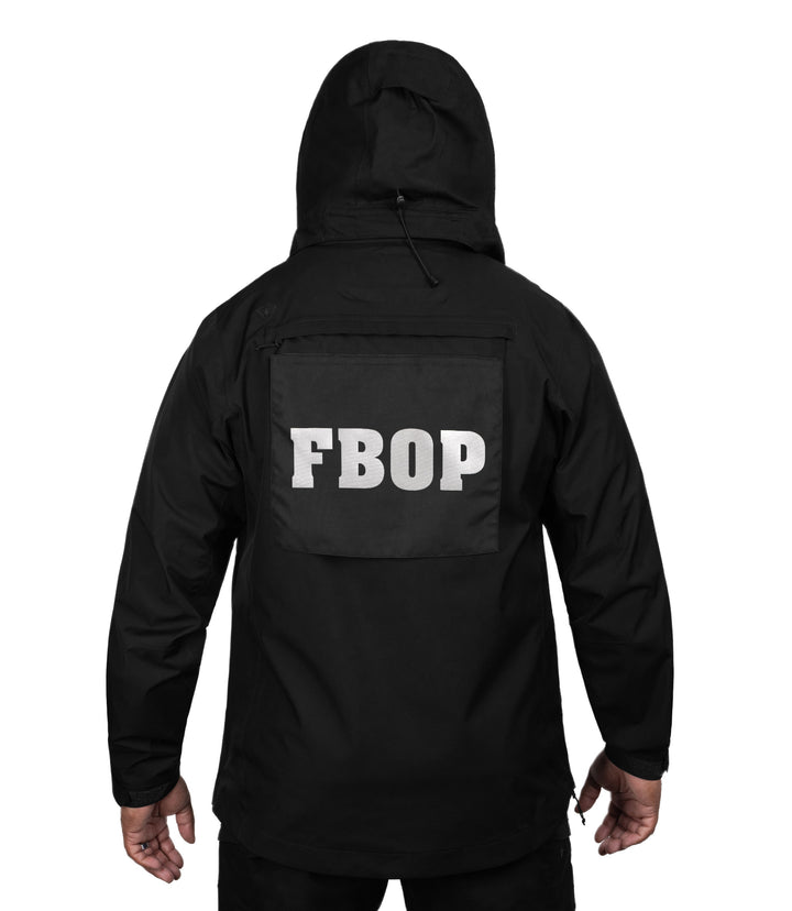 Back view with detachable pull-out panel of the Monsoon Parka in color black |color_black