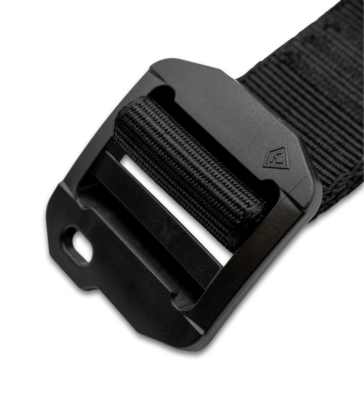 A close-up of a black tactical web belt with a matte black plastic quick-release buckle, shown on a clean white background |color_black