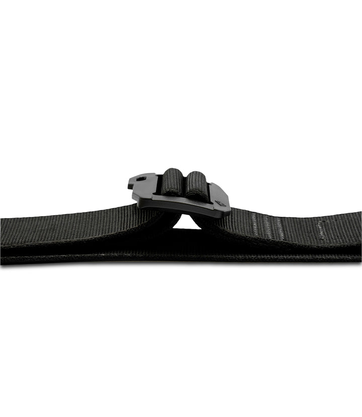 Close-up of a black webbed belt with a black plastic quick-release buckle lay flat on a plain white background |color_black