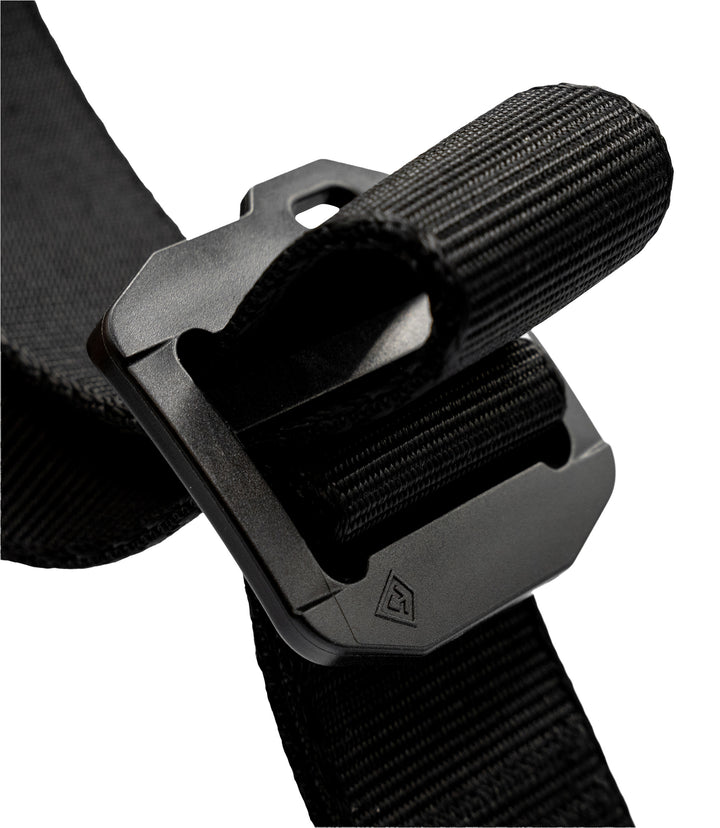 Close-up of a black adjustable webbing strap with a matte black plastic buckle, shown on a plain white background |color_black