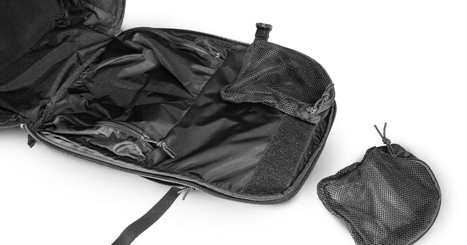 The large main compartment opens to a single mesh pocket and 2 interior drop pockets with hook/loop cinch. On the back, a hook/loop organization platform allows for ultimate customization on your longer journeys.