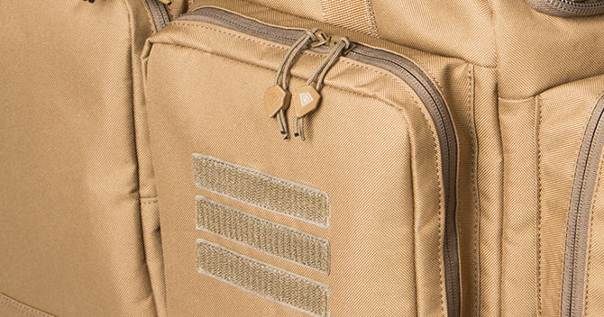 Specialized compartment for storage of tactical cleaning tools. The pocket flap unzips and folds down to reveal an oil resistant lining made for your pistol cleaning needs.